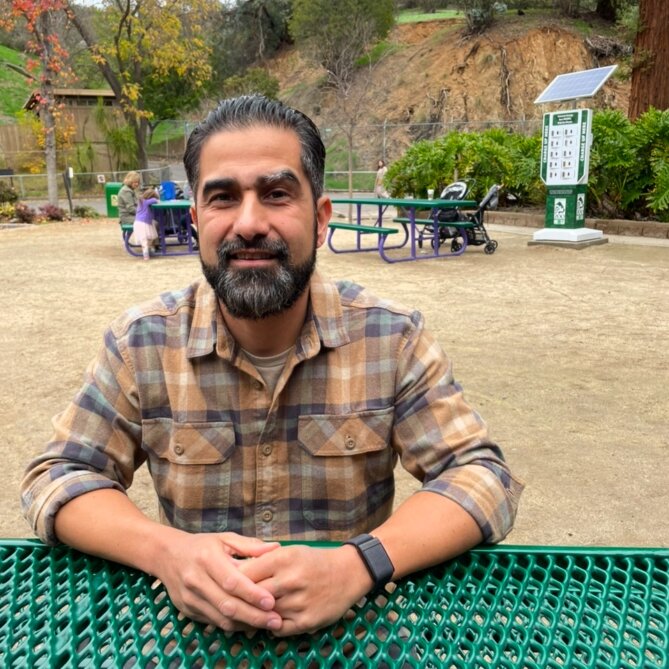 Juan Sitting on a bench